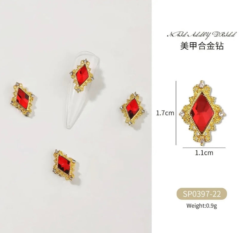 A set of Zircon Variety Charms earrings in red and gold with measurements, made by Luxenailhaven.