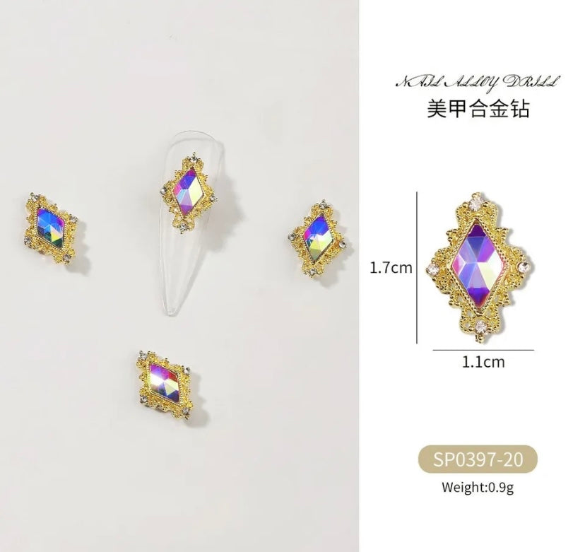 A set of Zircon Variety Charms rhinestone nail studs by Luxenailhaven.