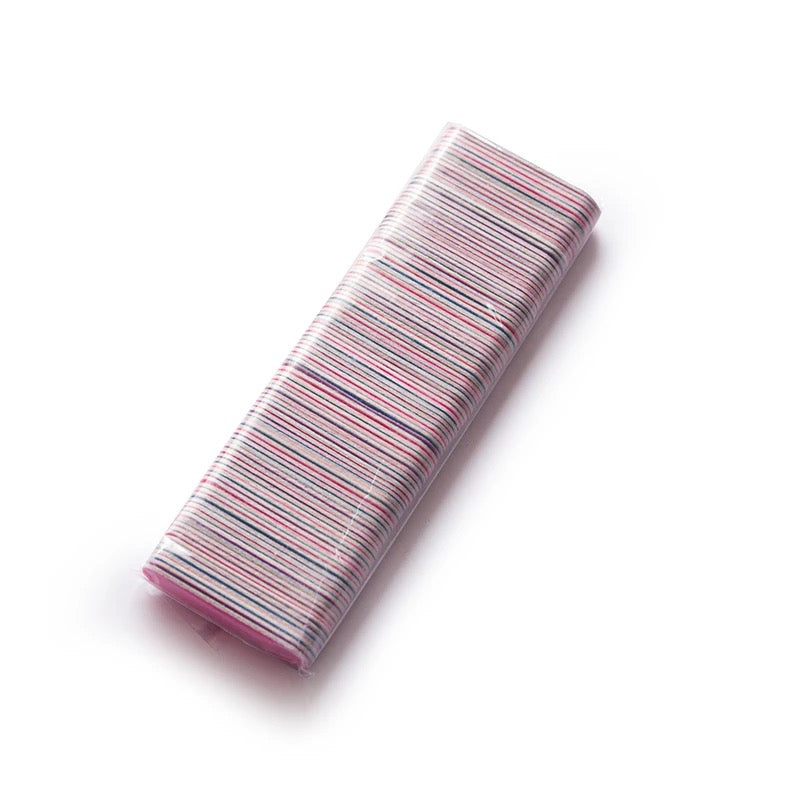 A pink and white striped Luxenailhaven mini files pencil case on a white surface.